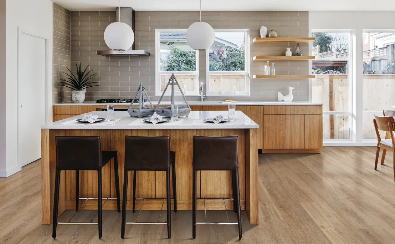 Kitchen with oak wood accents and white countertops